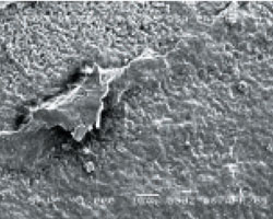 The same varnish material is shown at 1,000x magnification using a scanning electron microscope The same varnish material is shown at 1,000x magnification using a scanning electron microscope