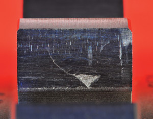 This is an example of point-surface- origin (PSO) macropitting caused by tip-to-root interference. This is an example of point-surface- origin (PSO) macropitting caused by tip-to-root interference.