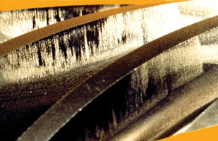 A lubricant with inadequate anti-scuff additives caused scuffing on this spiral bevel pinion. A lubricant with inadequate anti-scuff additives caused scuffing on this spiral bevel pinion.