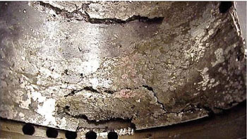 Figure 5. Loss of overlay (Babbitt) material down to the base metal Figure 5. Loss of overlay (Babbitt) material down to the base metal