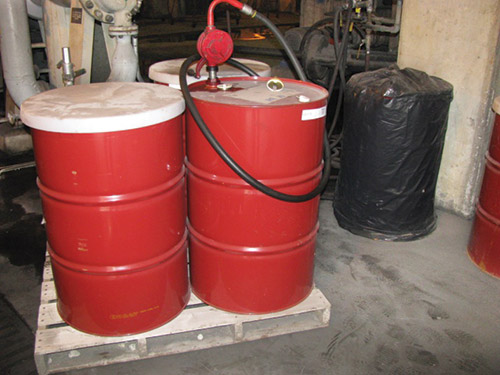 Previously, oil drums at the Georgetown mill were stored in an open building with covers or plastic bagsto keep out contaminants. Previously, oil drums at the Georgetown mill were stored in an open building with covers or plastic bagsto keep out contaminants.