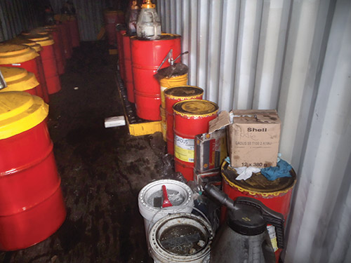 Before Suncoke implemented its lubrication program, coal and coke dust accumulated on transferring equipment, oil drums and grease cartridges. Before Suncoke implemented its lubrication program, coal and coke dust accumulated on transferring equipment, oil drums and grease cartridges.