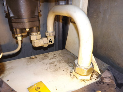 A fitting (marked “A”) on this hydraulic pump suction line vibrated loose after 12 years, leading to aeration. A fitting (marked “A”) on this hydraulic pump suction line vibrated loose after 12 years, leading to aeration.