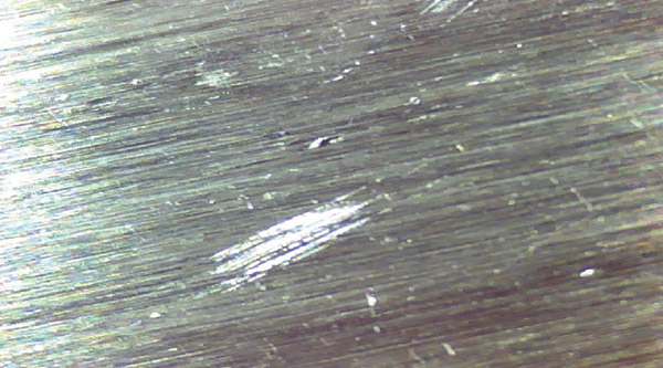 These indentations in a gearbox’s input shaft inboard bearing inner race weren’t entirely caused by putting dirty oil in the gearbox, but they do illustrate the effects of contaminants in lubrication. These indentations in a gearbox’s input shaft inboard bearing inner race weren’t entirely caused by putting dirty oil in the gearbox, but they do illustrate the effects of contaminants in lubrication.