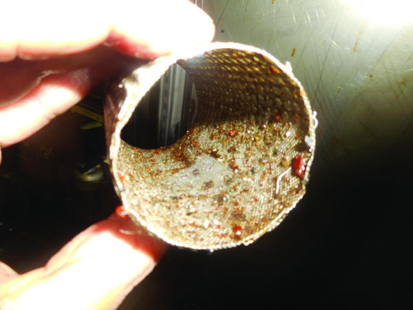 A dirty suction strainer is shown. A dirty suction strainer is shown.
